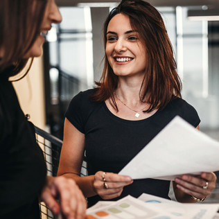 Photo of two women talking
